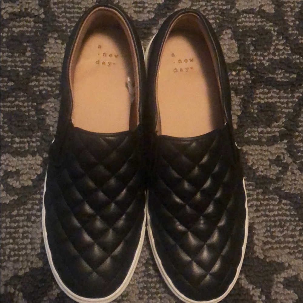 Black quilted slip ons